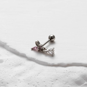 Detailed shot of silver butterfly cartilage stud with pink and teardrop zircon stones