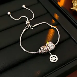 Silver snake chain bracelet with crystal heart beads and adjustable slider buckle
