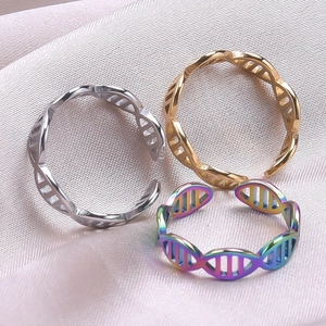 Three minimalist DNA spiral stainless steel open rings in gold, silver and rainbow colors