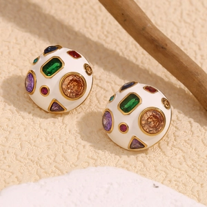 Detail of 18K gold plated hemisphere earring with colorful zircon and white enamel