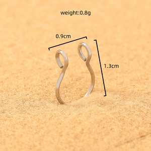 Macro shot of silver U-shaped stainless steel nose ring with dimensions and weight specs