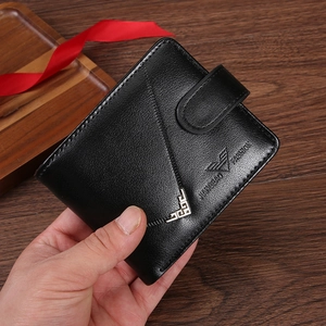 Men's vintage black leather bifold wallet with snap closure and metallic corners