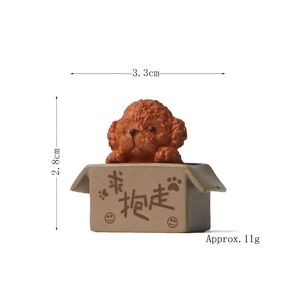 Macro shot of miniature brown Teddy dog figurine in resin box with 3.3cm width detail