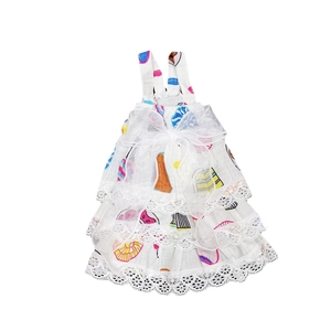 Detail of floral pet dress with large white organza bow and delicate lace layers