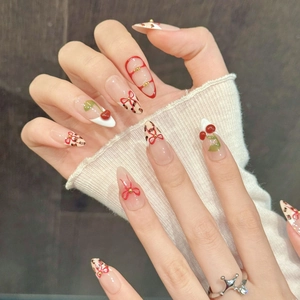Pink leopard print press-on nails with 3D red bows and cherry art in long almond shape