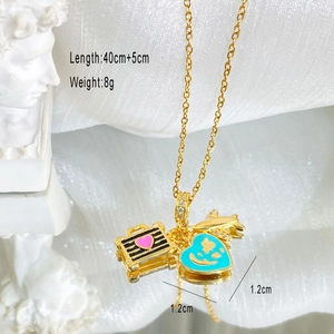 Detail of titanium steel necklace with airplane and luggage charms showing 40+5cm length