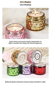 Detailed view of colorful embossed glass aromatic candles with metal lids and rose scent