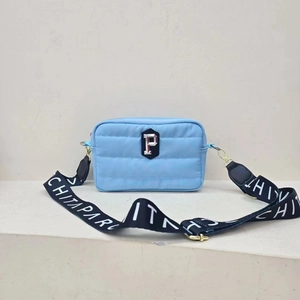 Blue quilted nylon crossbody bag with stylish P patch and wide logo strap