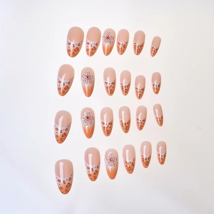 French leopard print press-on nails with 3D white flowers and rhinestones on almond shape