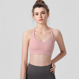 Soutien-gorge de sport rose et legging gris à taille haute pour le fitness féminin