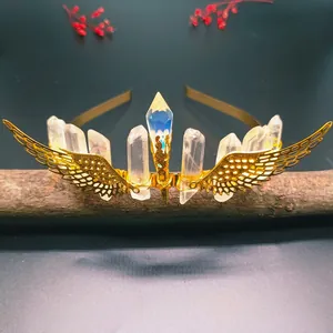 Golden bridal crown with natural crystal points and intricate hollowed wing accents