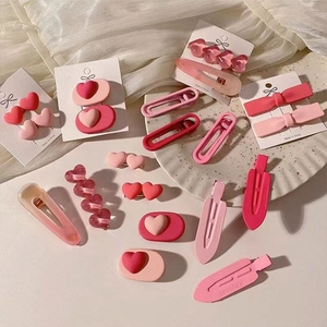 Pink and red y2k aesthetic heart and bow hair clips set on white decorative background