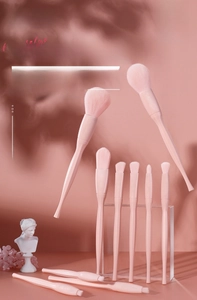 Detailed view of 10pcs candy pink makeup brush set with ergonomic handles and soft bristles