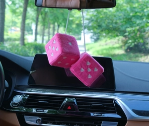 Pink plush dice car hanging ornament with white embroidered hearts on rearview mirror