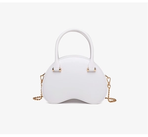 Close-up of white PVC half-moon bag with golden metal chain strap and hardware detail
