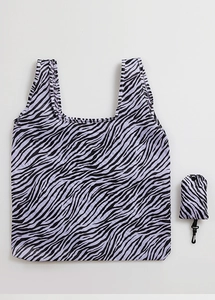 Detail view of foldable purple zebra print shopping bag in both open and folded states