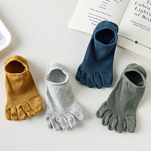Close-up of four pairs of breathable mesh five-toe socks in yellow, grey, blue and green