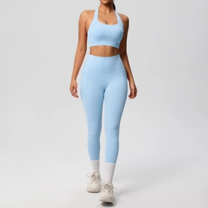 Light blue two-piece yoga set featuring a halter neck sports bra and pocketed leggings