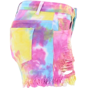 Detail of high waist tie-dye denim shorts featuring distressed ripped sides and frayed edges