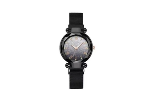 Detailed macro view of multifaceted glass case and gradient starry dial on women's watch