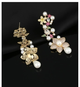 Detailed close-up of floral tassel earrings with colorful zircons and teardrop pearls