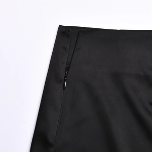 Detail shot of the black dress featuring a high-quality side invisible zipper closure