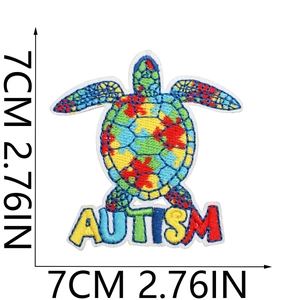 Turtle shaped autism awareness embroidery patch with puzzle pattern and dimension labels