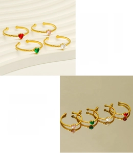 Detail of 18K gold-plated stainless steel heart rings with colorful zircon inlays