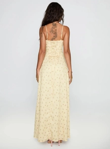 Detail of cross back straps and floral print on bohemian summer maxi dress