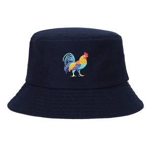 Close-up of navy blue bucket hat featuring colorful rooster embroidery and fine stitching