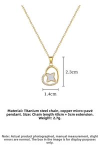 Detail of gold heart pendant with star inlay and cubic zirconia on 40cm chain