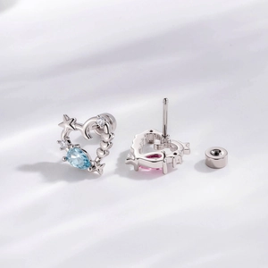 Hollow heart cartilage studs with moon, stars, and teardrop zircons in silver finish
