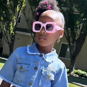 Pink square bubble frame sunglasses for kids featuring a stylish and fun chunky design