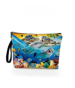 Detailed pattern display of dolphin and tropical fish print on the oceanic makeup bag