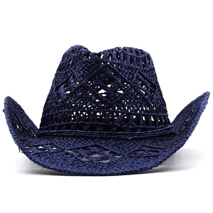 Detailed macro view of dark blue hollow crochet patterns on this straw cowboy hat