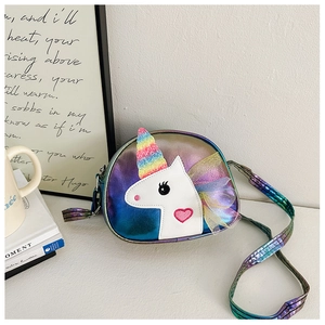 Close-up of cute unicorn crossbody bag with rainbow sequins and colorful mesh mane