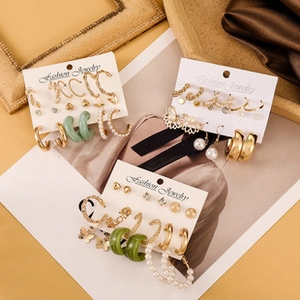 Detailed view of assorted butterfly and heart earring sets on elegant display cards