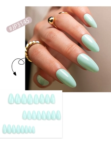 Close-up of mint green almond-shaped press-on nails with glossy finish on fingers