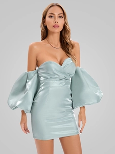 Detail of light blue satin off-shoulder dress with elegant puff sleeves and glossy texture