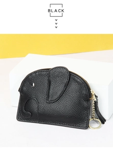 Close-up of black lychee grain leather elephant coin purse with gold zipper and keyring