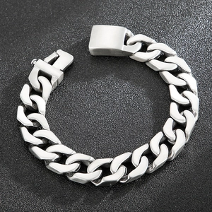 Close-up of industrial silver stainless steel Cuban link bracelet with a matte finish