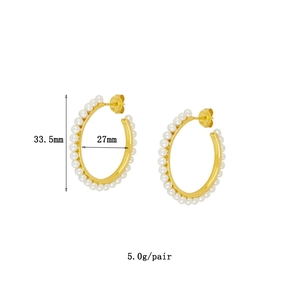 Detail showing 33.5mm golden hoop earrings with pearls and size measurement labels