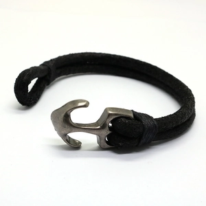 Vintage men's braided leather bracelet with an antique silver anchor shackle closure