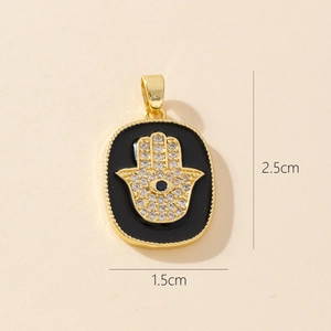 Detailed view of Hamsa Hand pendant with cubic zirconia and 2.5cm x 1.5cm size markings