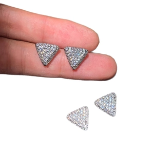 Sparkling zircon triangle stud earrings set with silver pavé finish in minimalist style