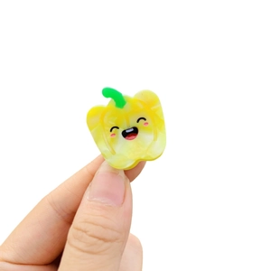 Cute yellow bell pepper acetate hair clip with a smile face design in y2k style