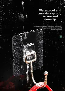 Macro view of strong adhesive wall hook with water spray showing waterproof feature