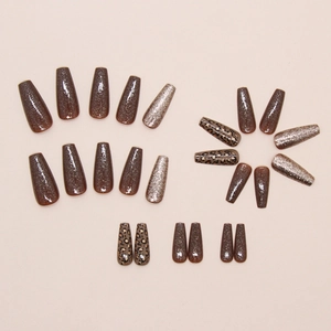 Caramel leopard print press-on nails with glitter accents in long coffin shape