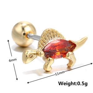 Macro view of gold dinosaur helix piercing with red gemstone and screw ball back details