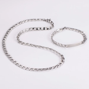Detail showing silver Cuban link necklace and matching bracelet with flat engraving plate
